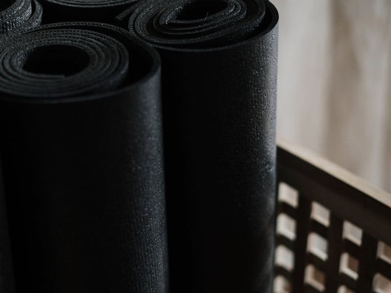 Detailed view of yoga mat and supporting equipment